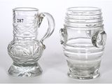 two glass vases sitting next to each other on a table