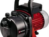 an image of a red and black pump sitting on top of a white surface