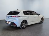 the rear end of a white car in a white room