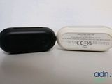 two black and white electronic devices sitting on a table