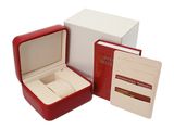 a red box with a watch inside of it next to a white box