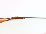 an old rifle with a wooden barrel on a white background