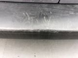 a close up of the front bumper of a car with scratches on it