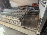 a lot of metal equipment that are sitting on the floor