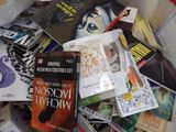 a pile of books that are sitting on a table