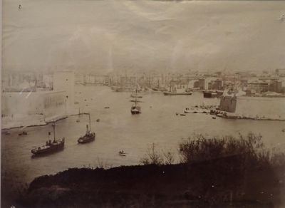 an old photo of a harbor with ships in the water