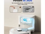 une photo d'un robot aspirateur blanc posé sur le sol
