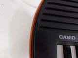 a close up of a black and orange piano keyboard