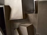 many different shapes and sizes of boxes stacked on top of each other