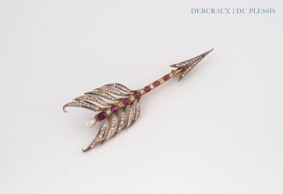 an image of a diamond and ruby arrow broochle