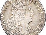 a close up of a coin with a woman ' s head on it