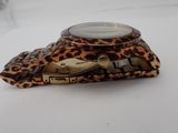 a leopard print case with a magnifying lens on it
