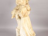a statue of a woman holding a child in her arms