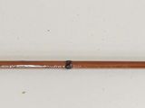 a picture of a fishing rod on a white wall