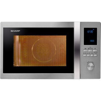 un micro-ondes argenté muni d'une horloge numérique sur la façade