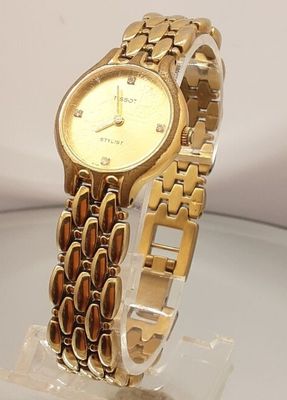 an image of a close up of a wrist watch on a table