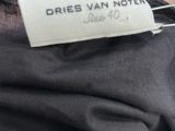 a close up of a label on a black shirt that says dries van noten