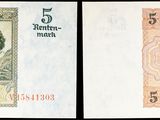 deux billets de banque différents, dont l'un comporte l'effigie d'une femme