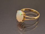 a close up of a ring with a white oplite in it