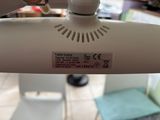 a close up of a person using a sewing machine
