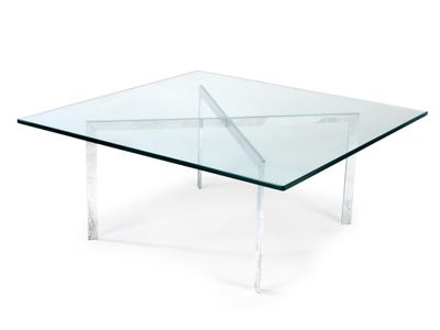 a glass coffee table with clear legs and a clear glass top