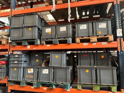 many bins on the shelves in the warehouse