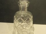 a glass bottle that is sitting on a table
