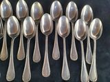 a lot of spoons that are sitting on a table