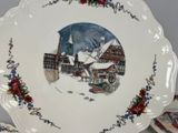 a plate with a picture of a town in the middle of it