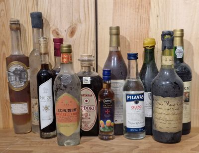 many different types of alcohol bottles lined up on a shelf