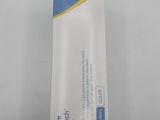 a close up of a box of toothpaste on a table