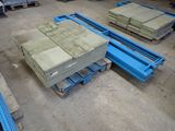 many stacks of concrete blocks on a pallet in a warehouse