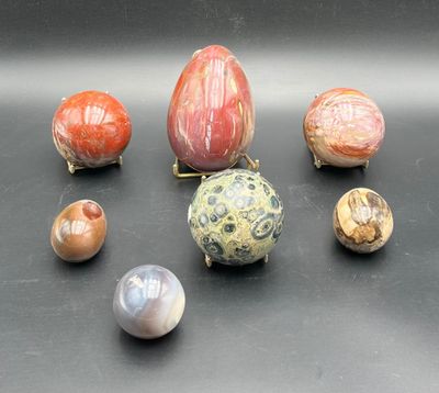 a lot of different types of marbles on a table