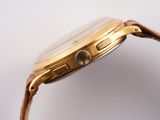 an image of a close up of a watch on a white surface