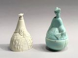 two vases sitting next to each other on a table