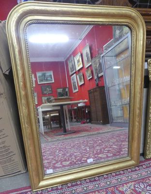 a mirror that is sitting on the floor in a room