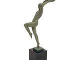 statue of a woman holding a tennis racquet on a black base