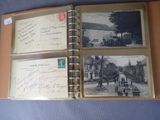 an old photo album with old postcards and old postcards