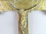 a gold cross with a crucifier on it