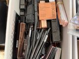 a box full of makeup and other items in it