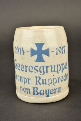 a mug with a blue cross on it on a table
