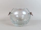 a glass vase with a handle on a white surface