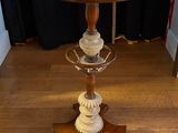 a wooden table with a glass top on a hard wood floor