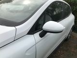 a white car parked on the side of the road