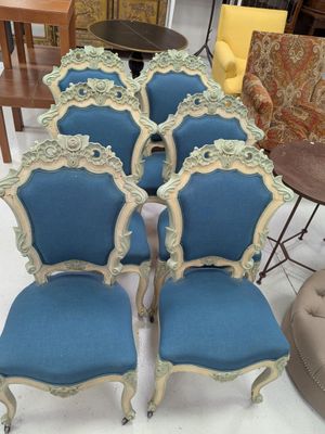 several chairs and tables are arranged in a room with a table and chairs