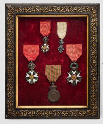 an old picture of a picture of a medal display in a frame