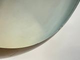 a glass bowl on a table with a white background