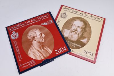 the two books are sitting on a white surface