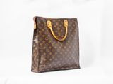 a brown louis vuitton bag on a white background