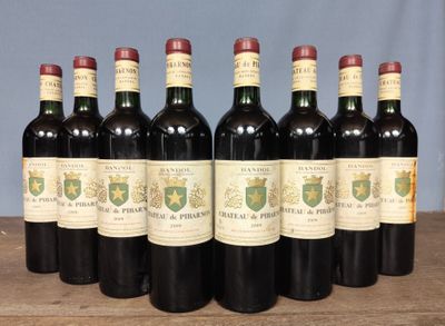 six bottles of wine are lined up in a row on a table